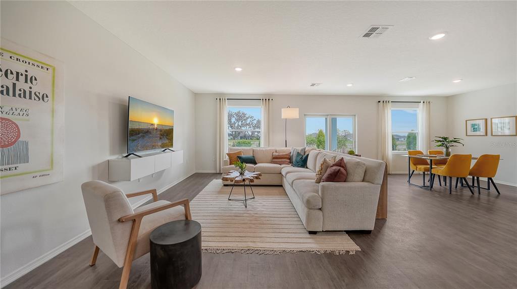 13113 Bayberry Way Parrish, FL 34219 - Photo 3 of 20 a living room with furniture and a flat screen tv