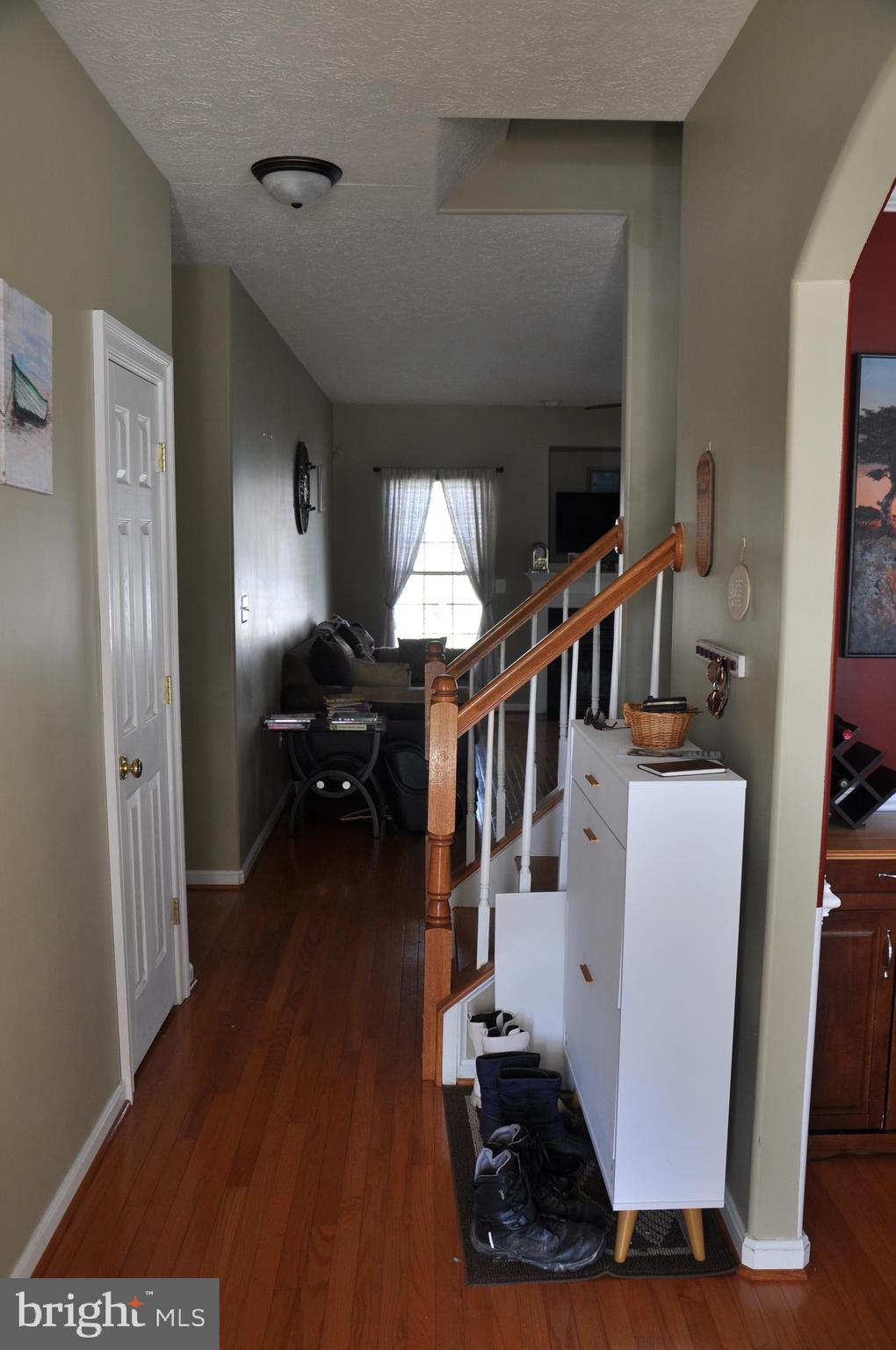 10621 Gallant Fox Way Ruther Glen, VA 22546 - Photo 12 of 65 a view of entryway and hall with wooden floor
