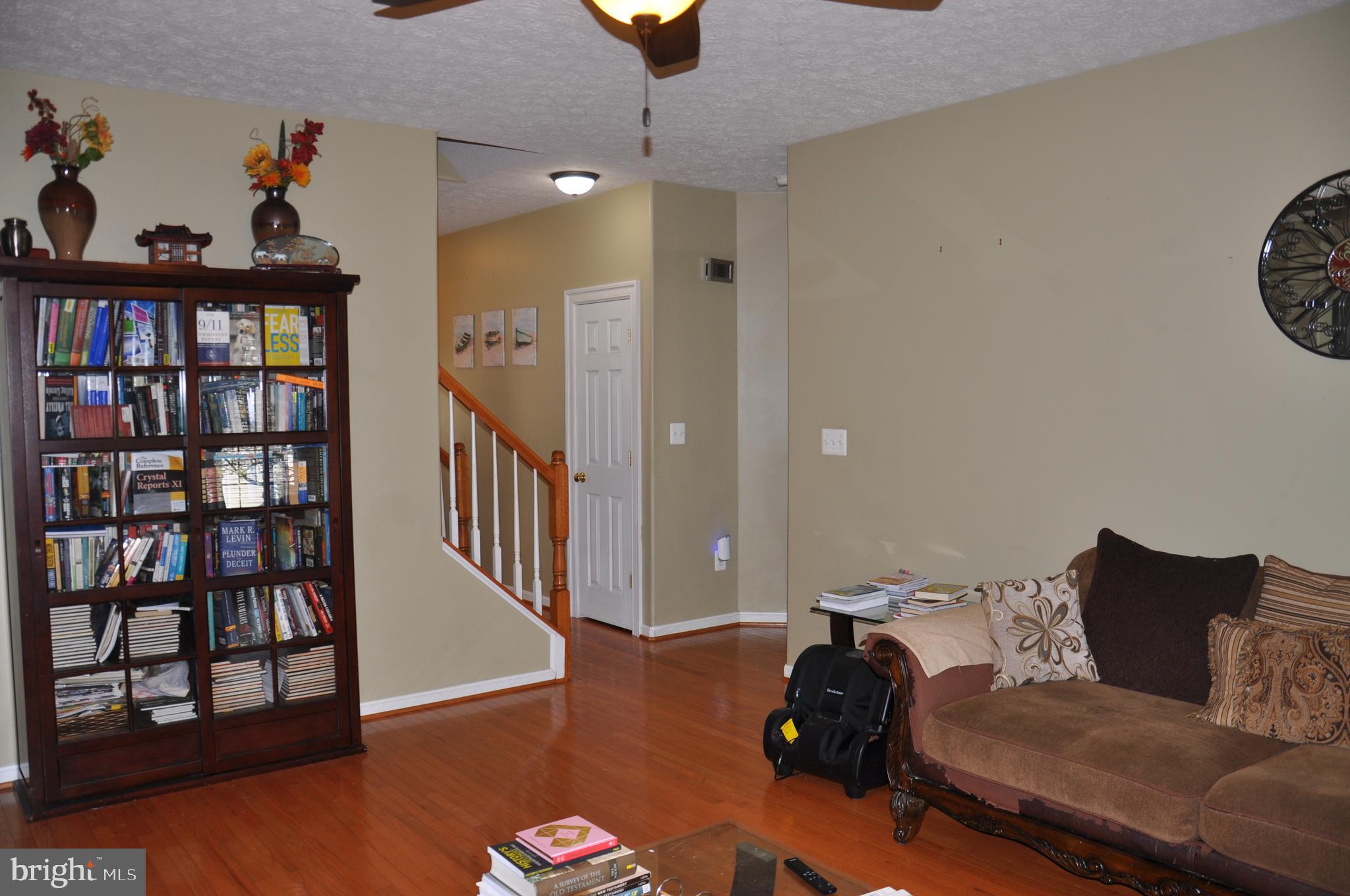 10621 Gallant Fox Way Ruther Glen, VA 22546 - Photo 19 of 65 a living room with furniture and a window