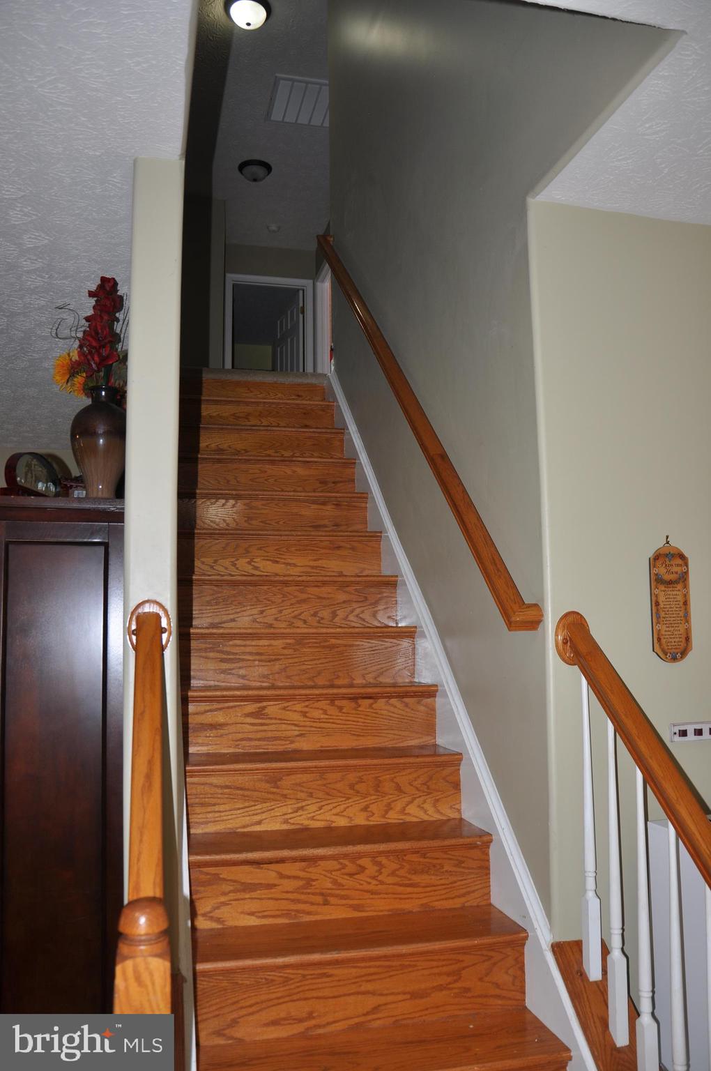 10621 Gallant Fox Way Ruther Glen, VA 22546 - Photo 36 of 65 a view of entryway and hall with wooden floor