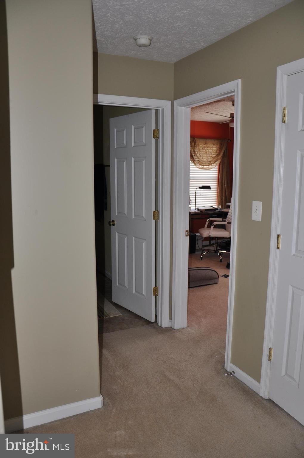 10621 Gallant Fox Way Ruther Glen, VA 22546 - Photo 38 of 65 a view of a livingroom from a hallway