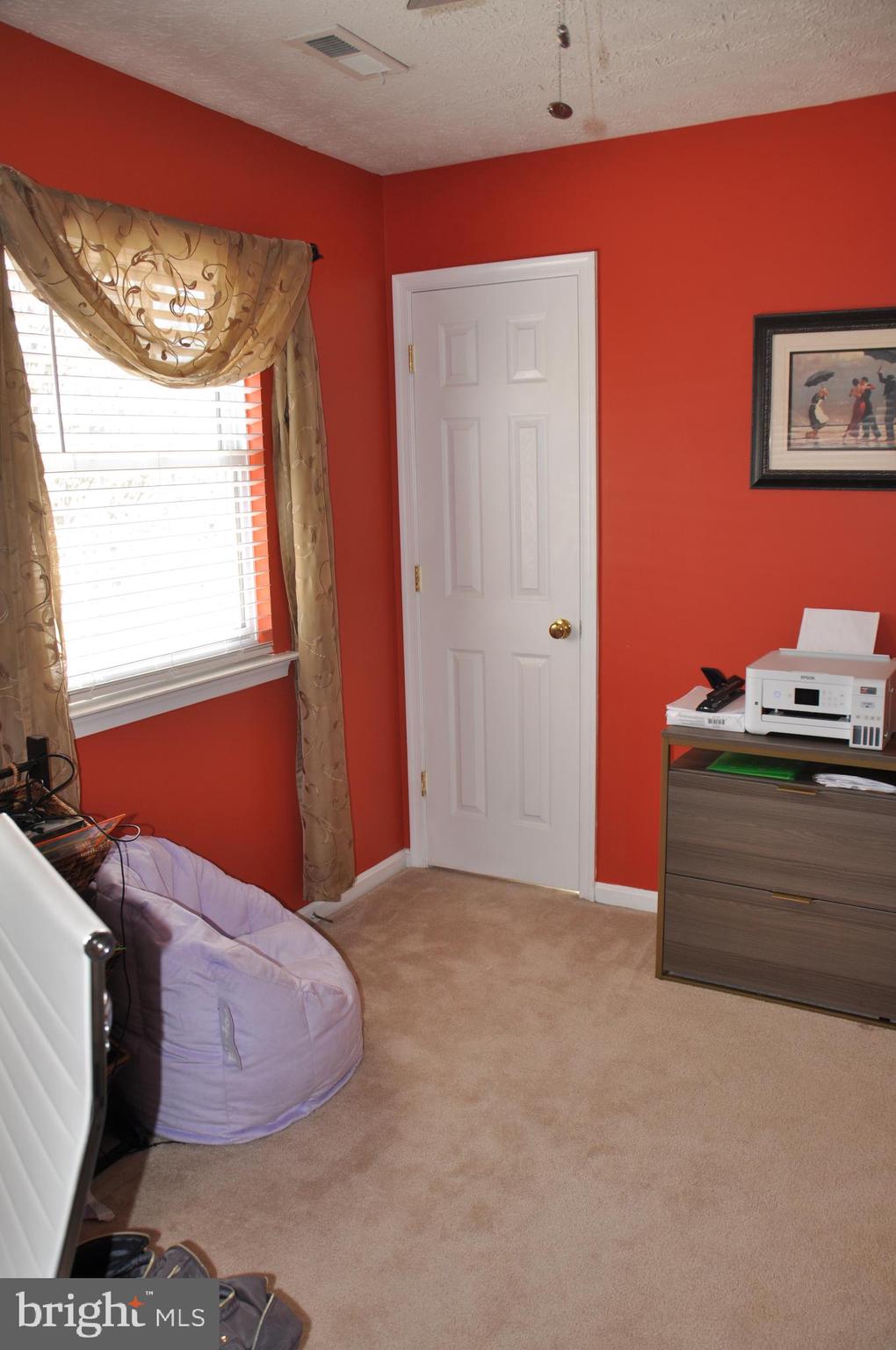 10621 Gallant Fox Way Ruther Glen, VA 22546 - Photo 46 of 65 a bedroom with a bed and window