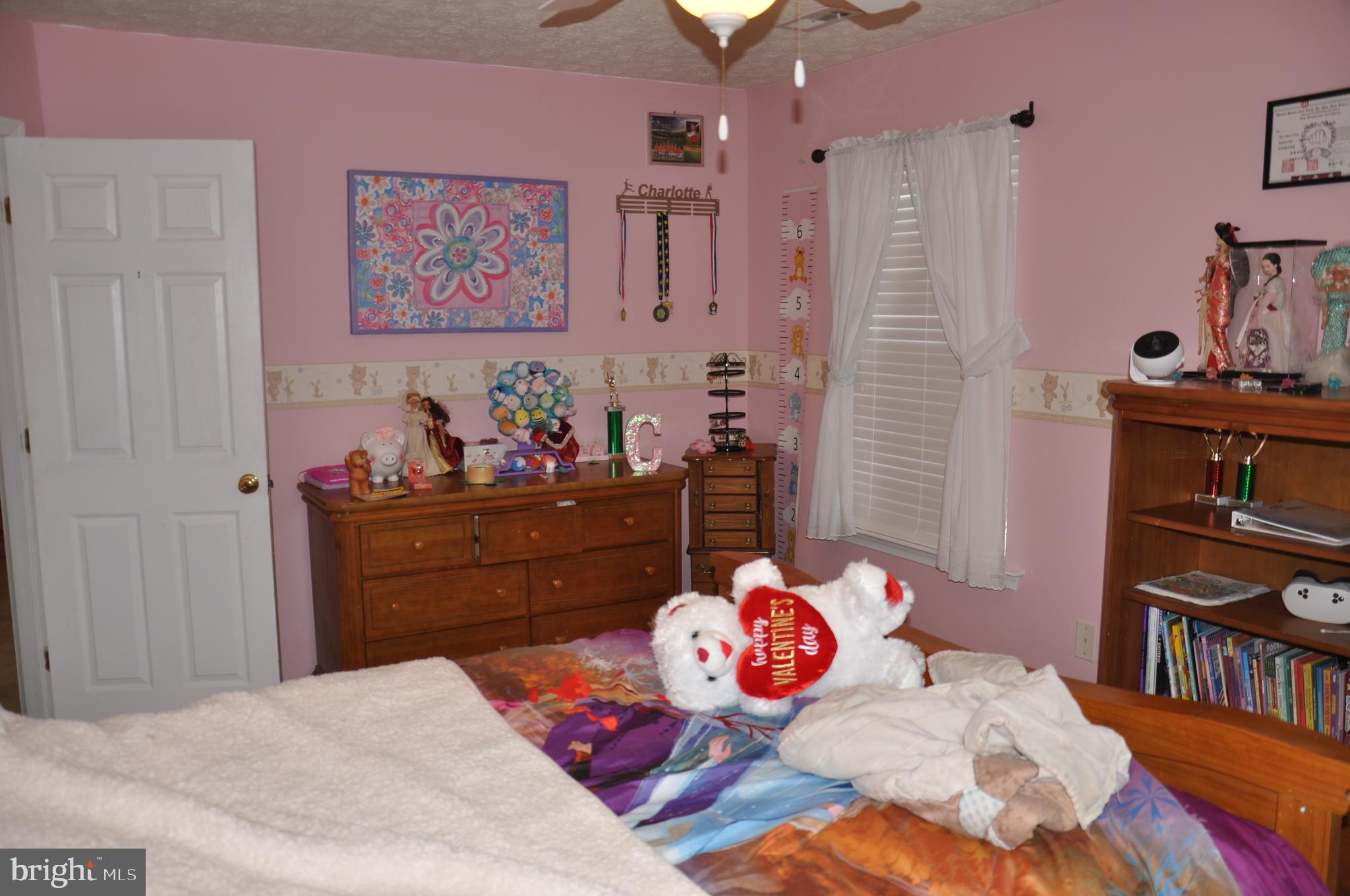10621 Gallant Fox Way Ruther Glen, VA 22546 - Photo 50 of 65 a bedroom with a bed and closet