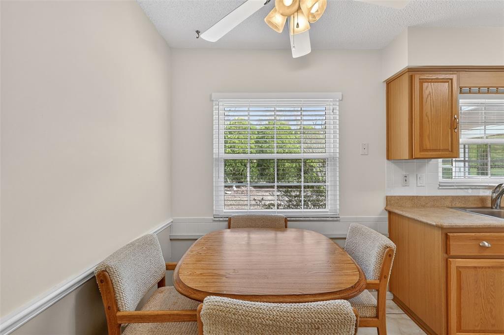 9398 Southeast 174th Loop Summerfield, FL 34491 - Photo 14 of 29 a outdoor dining space with furniture and a window