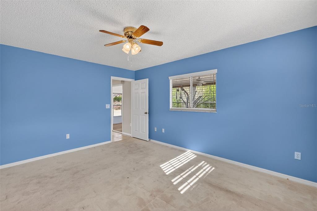9398 Southeast 174th Loop Summerfield, FL 34491 - Photo 16 of 29 a view of an empty room with a window