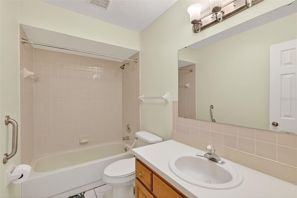 9398 Southeast 174th Loop Summerfield, FL 34491 - Photo 21 of 29 a bathroom with a sink toilet and shower