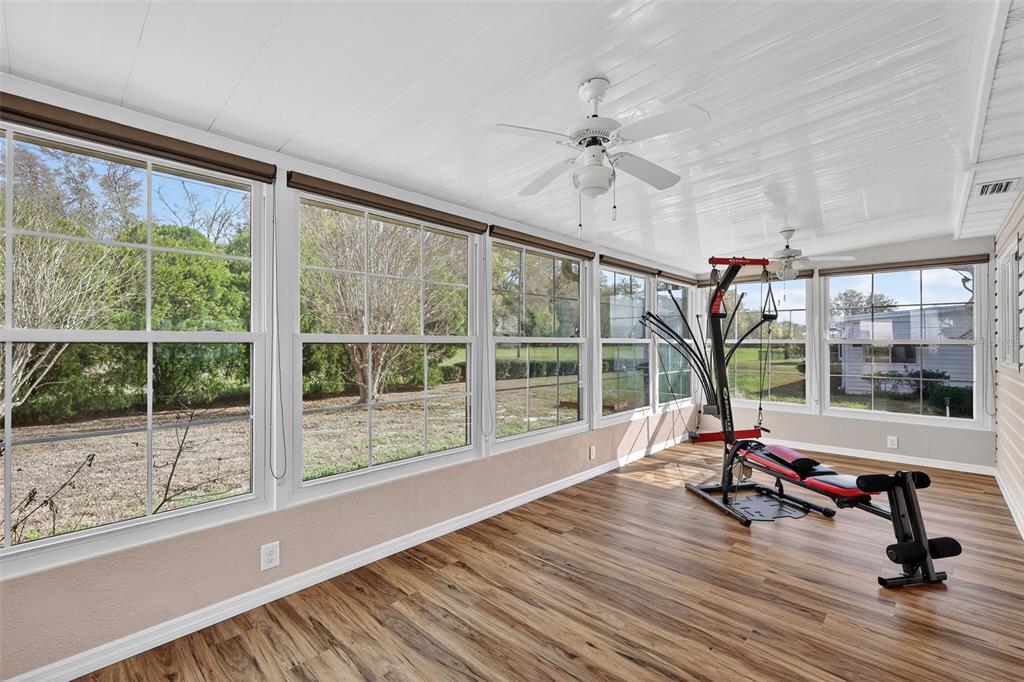 9398 Southeast 174th Loop Summerfield, FL 34491 - Photo 23 of 29 a living room with hardwood floor and windows