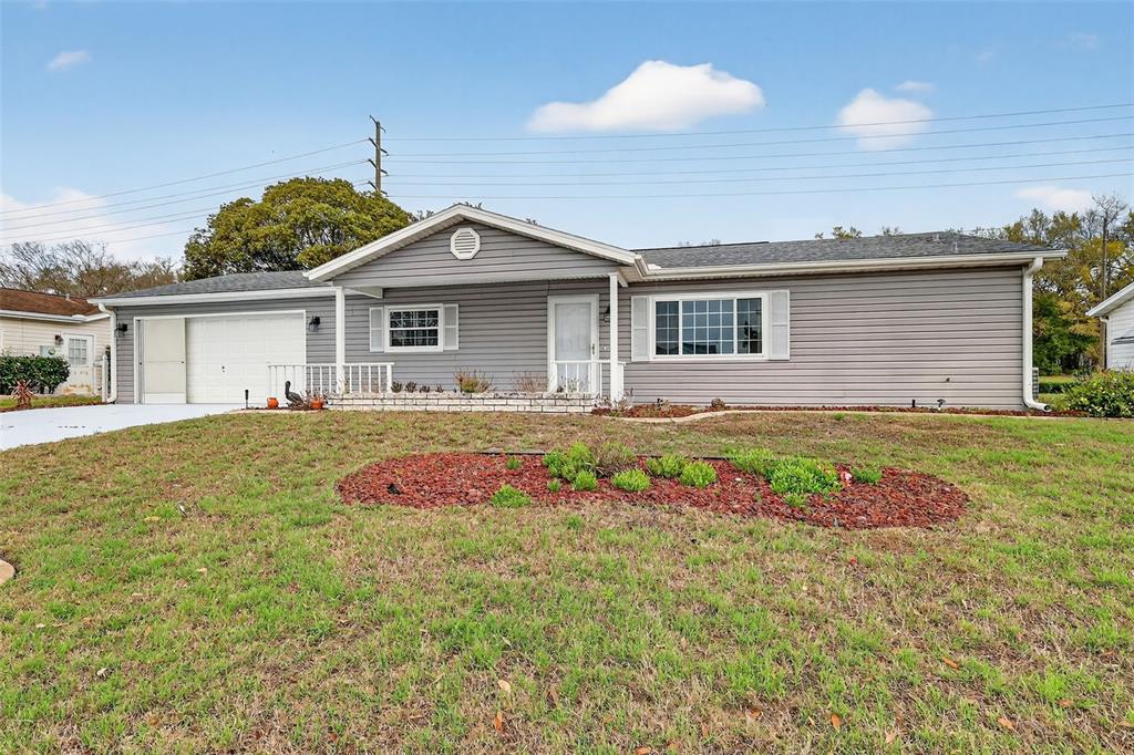 9398 Southeast 174th Loop Summerfield, FL 34491 - Photo 4 of 29 a front view of house with yard
