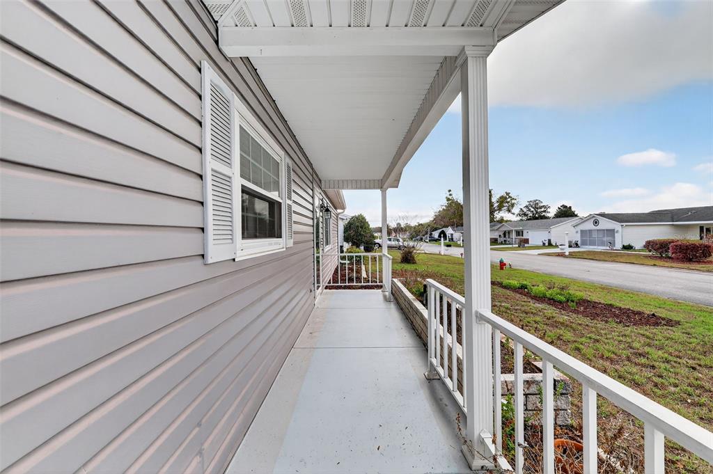 9398 Southeast 174th Loop Summerfield, FL 34491 - Photo 5 of 29 a view of a balcony with car parked