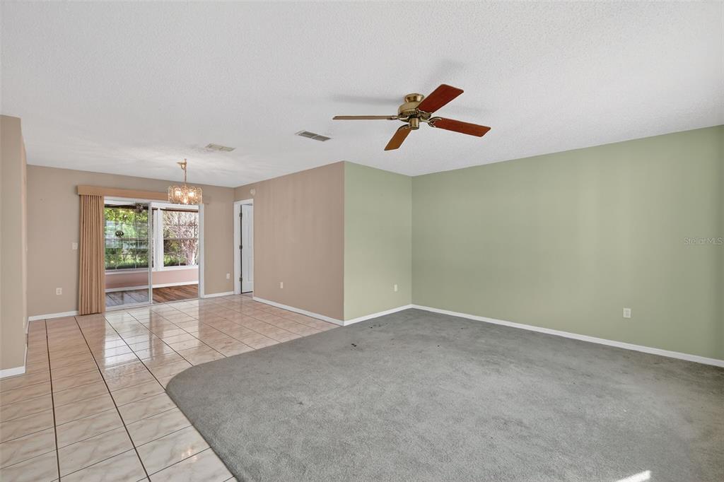 9398 Southeast 174th Loop Summerfield, FL 34491 - Photo 6 of 29 a view of room with a ceiling fan