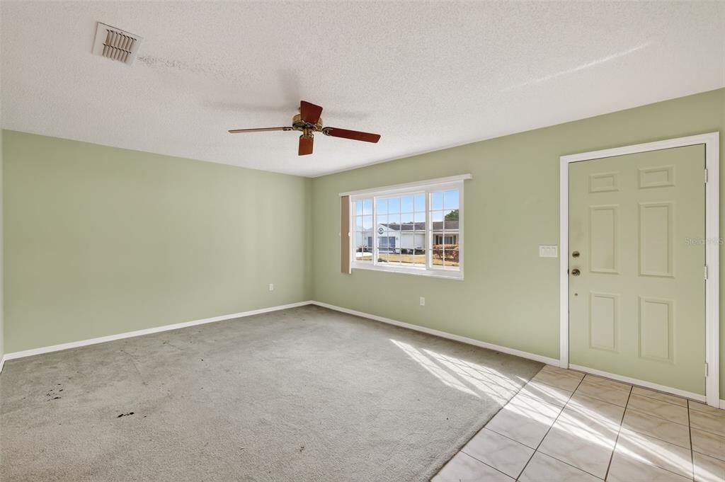 9398 Southeast 174th Loop Summerfield, FL 34491 - Photo 7 of 29 a view of an empty room with a window