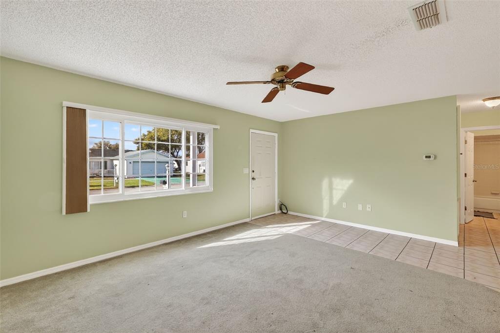 9398 Southeast 174th Loop Summerfield, FL 34491 - Photo 8 of 29 a view of empty room with windows
