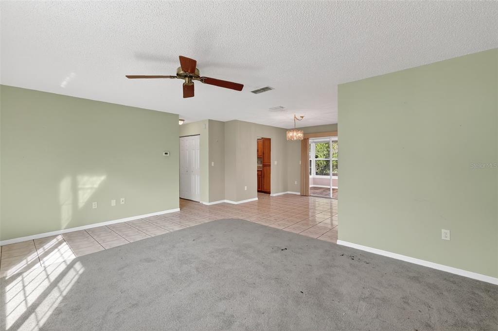 9398 Southeast 174th Loop Summerfield, FL 34491 - Photo 9 of 29 an empty room with a empty space and windows