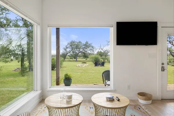 a view of a dining room with furniture window and outside view