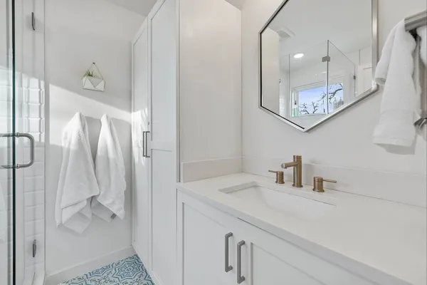a bathroom with a sink and a mirror