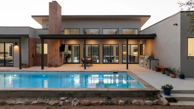a dining room with furniture and window