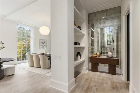 a view of living room and kitchen with windows