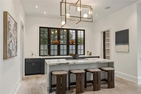a kitchen with stainless steel appliances granite countertop a stove and cabinets