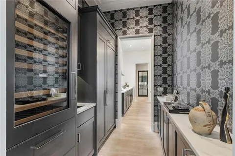 a kitchen with a refrigerator and a sink