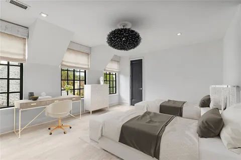 a bedroom with a bed and window