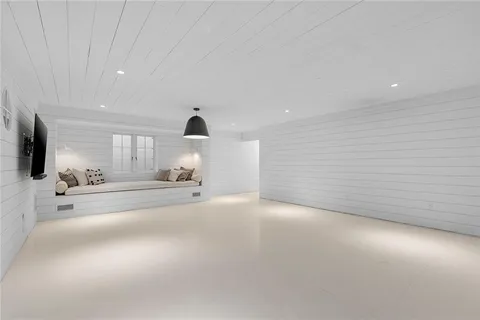 a view of a livingroom with furniture and a flat screen tv