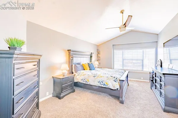 a bedroom with a bed and a table