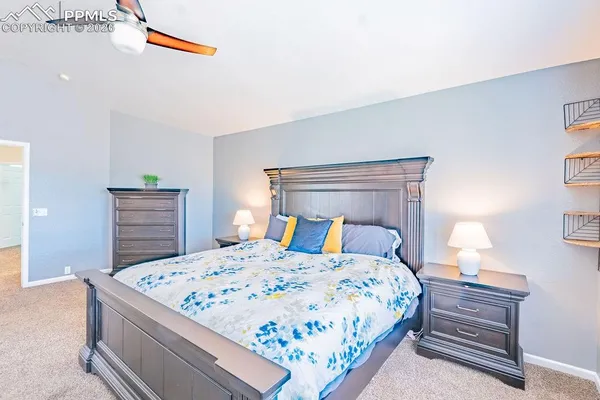 a bedroom with a bed and dresser