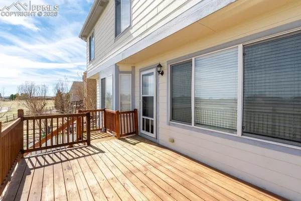 a view of backyard of house with outdoor seating