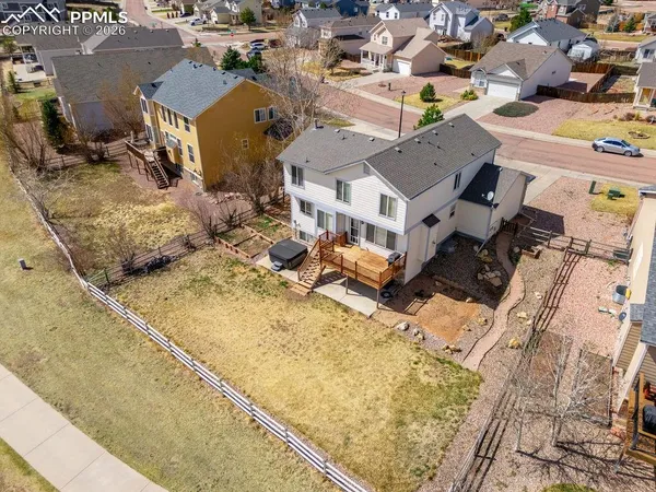 a view of a house with a snow in the background
