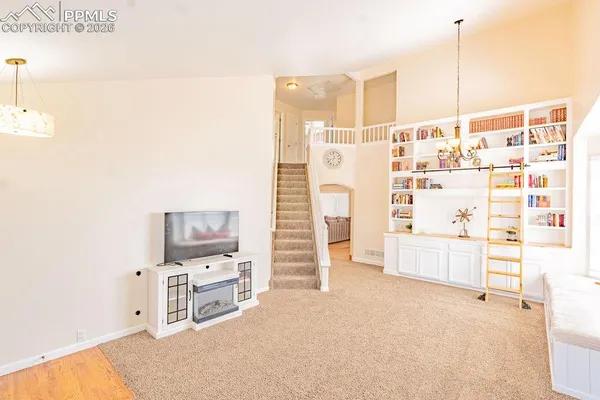 a room with a furniture and a flat screen tv