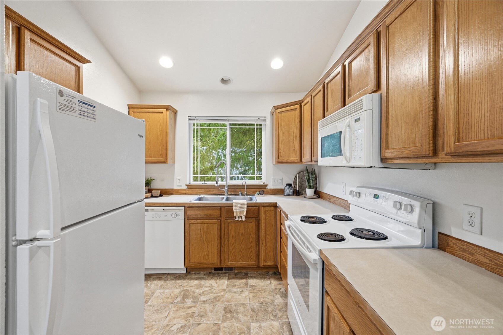 39 Sudden Valley Drive Bellingham, WA 98229 - Photo 7 of 40 a kitchen with a sink a stove and cabinets