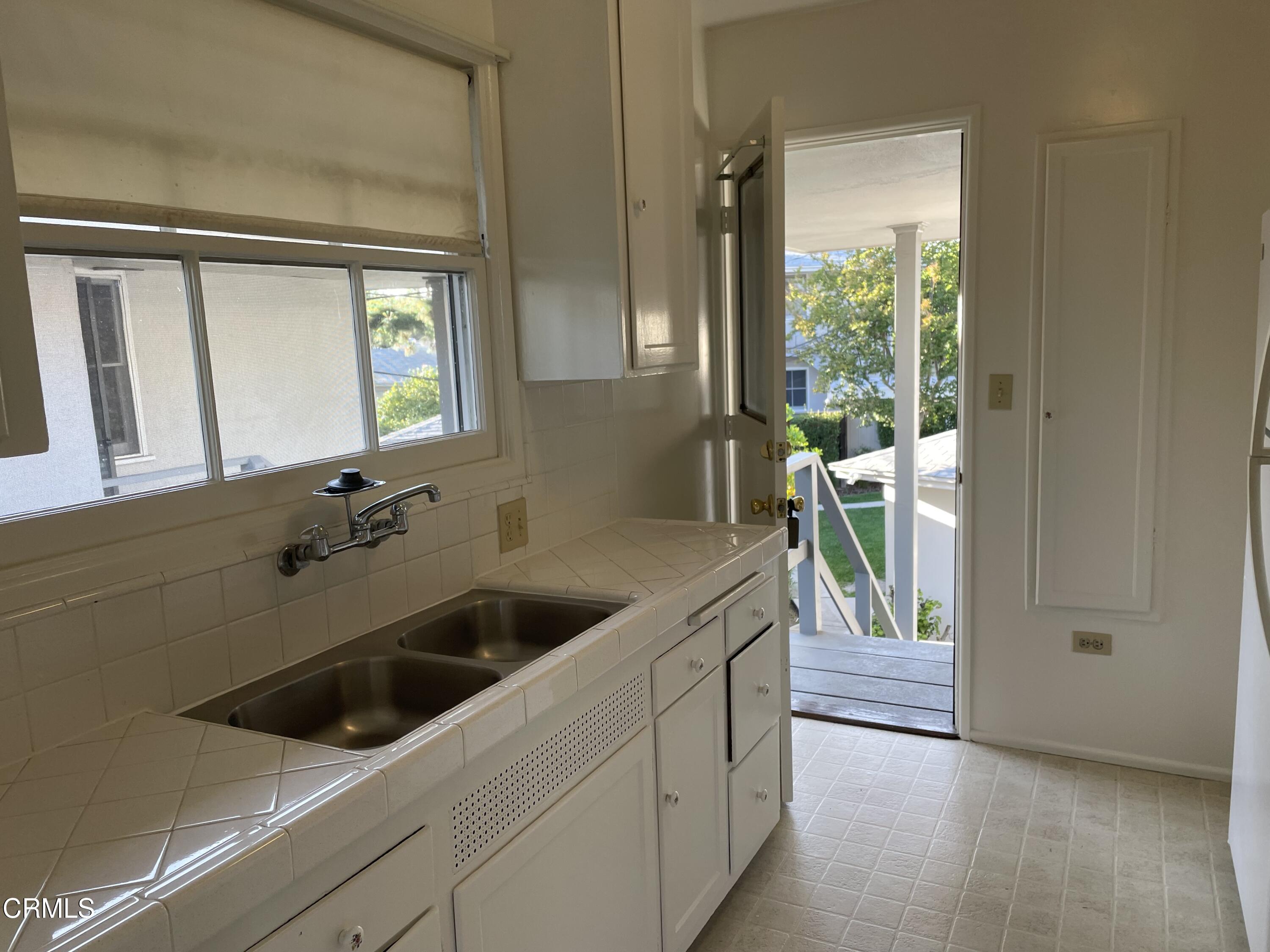 238 Mockingbird Lane South Pasadena, CA 91030 - Photo 9 of 18 a kitchen that has a sink and a stove