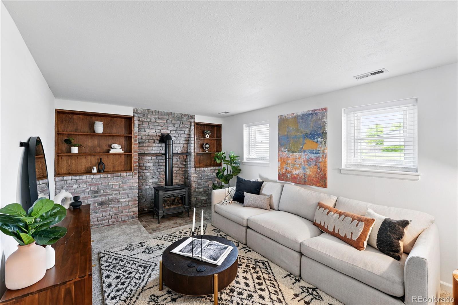 9315 Field Lane Westminster, CO 80021 - Photo 13 of 50 a living room with furniture and a wooden floor