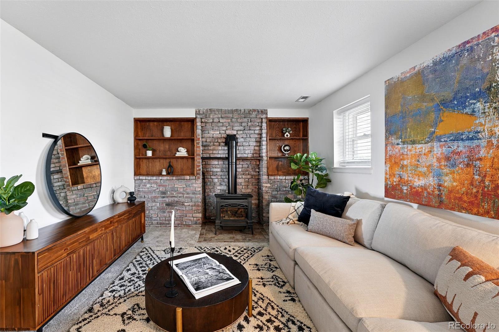 9315 Field Lane Westminster, CO 80021 - Photo 14 of 50 a living room with furniture and a window