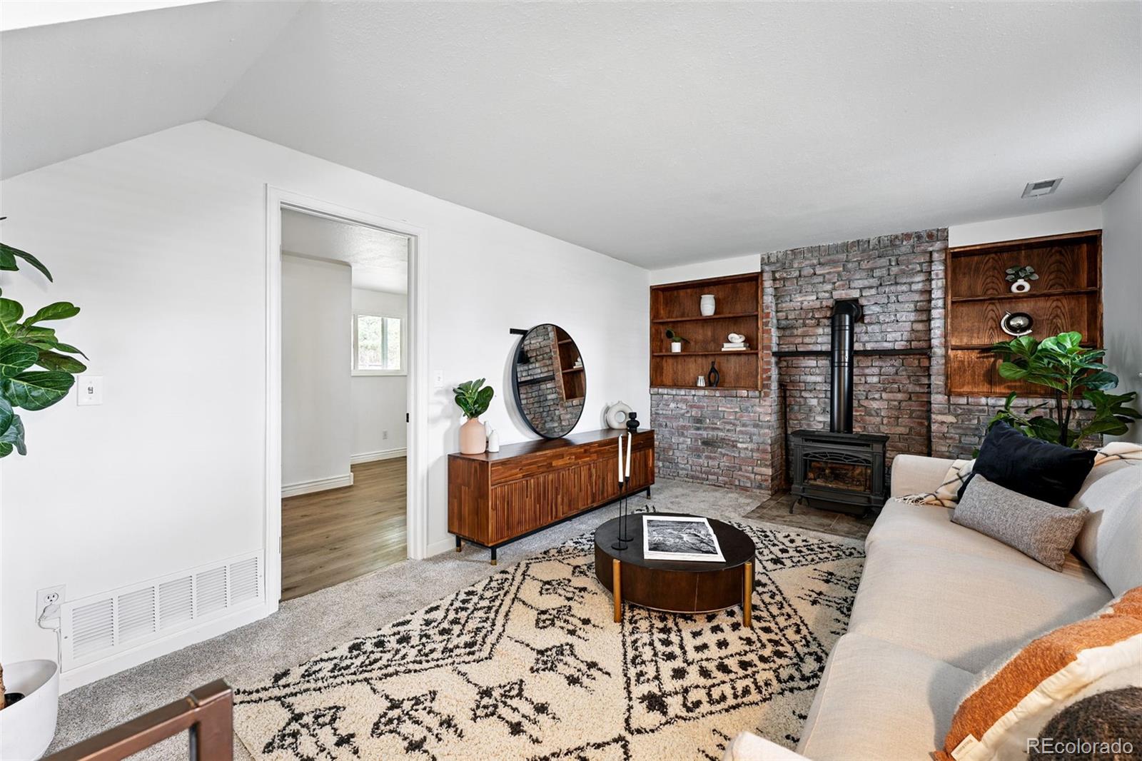 9315 Field Lane Westminster, CO 80021 - Photo 15 of 50 a living room with furniture rug and lamp