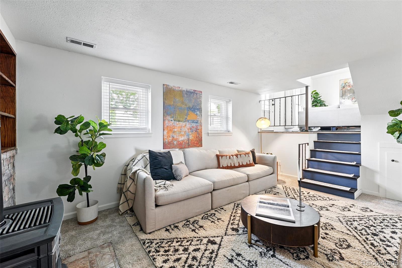 9315 Field Lane Westminster, CO 80021 - Photo 16 of 50 a living room with furniture and wooden floor