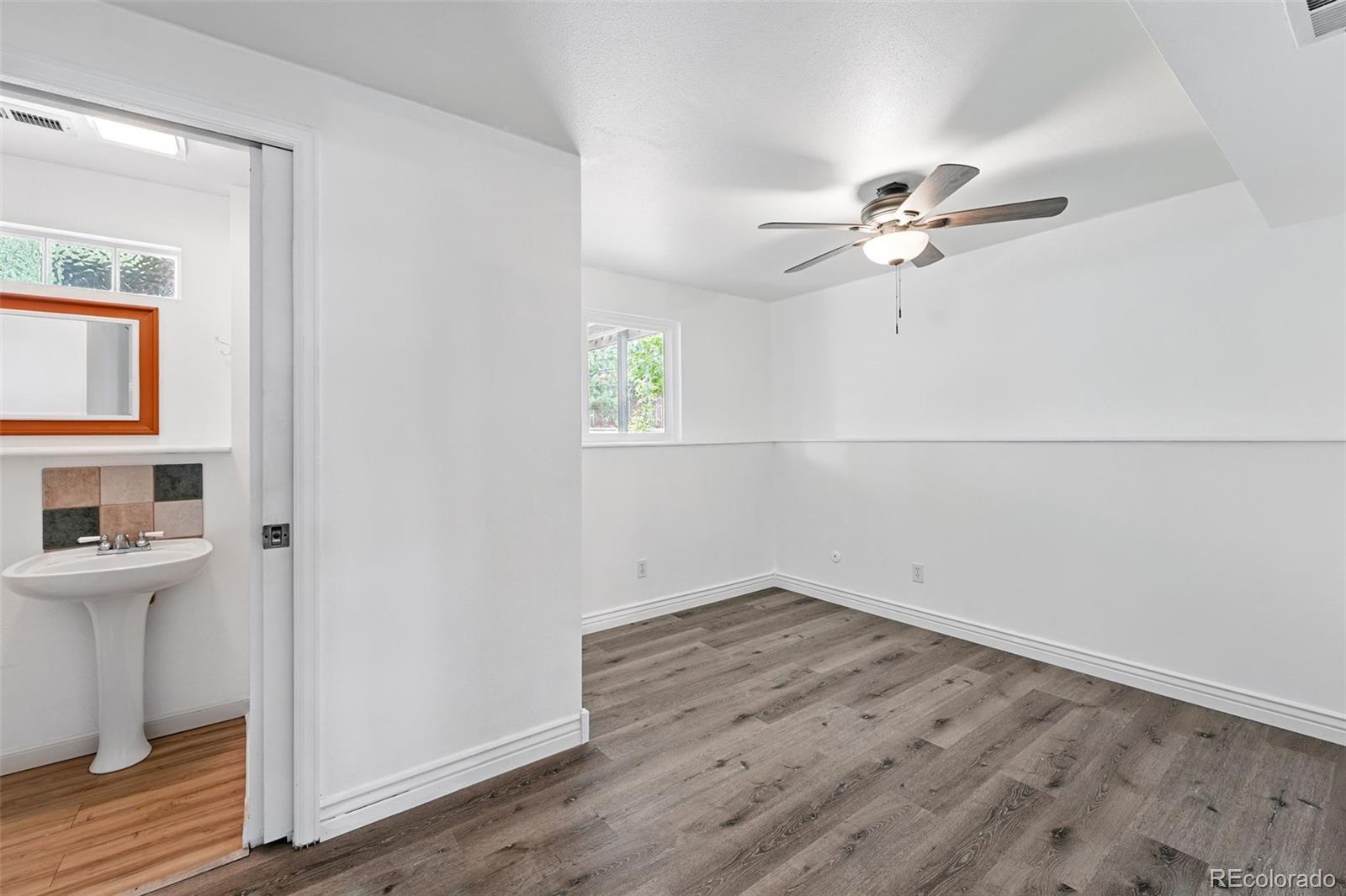 9315 Field Lane Westminster, CO 80021 - Photo 19 of 50 wooden floor in an empty room with a window
