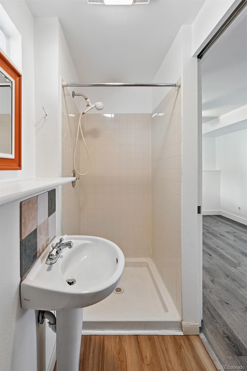 9315 Field Lane Westminster, CO 80021 - Photo 20 of 50 a bathroom with a sink and a mirror