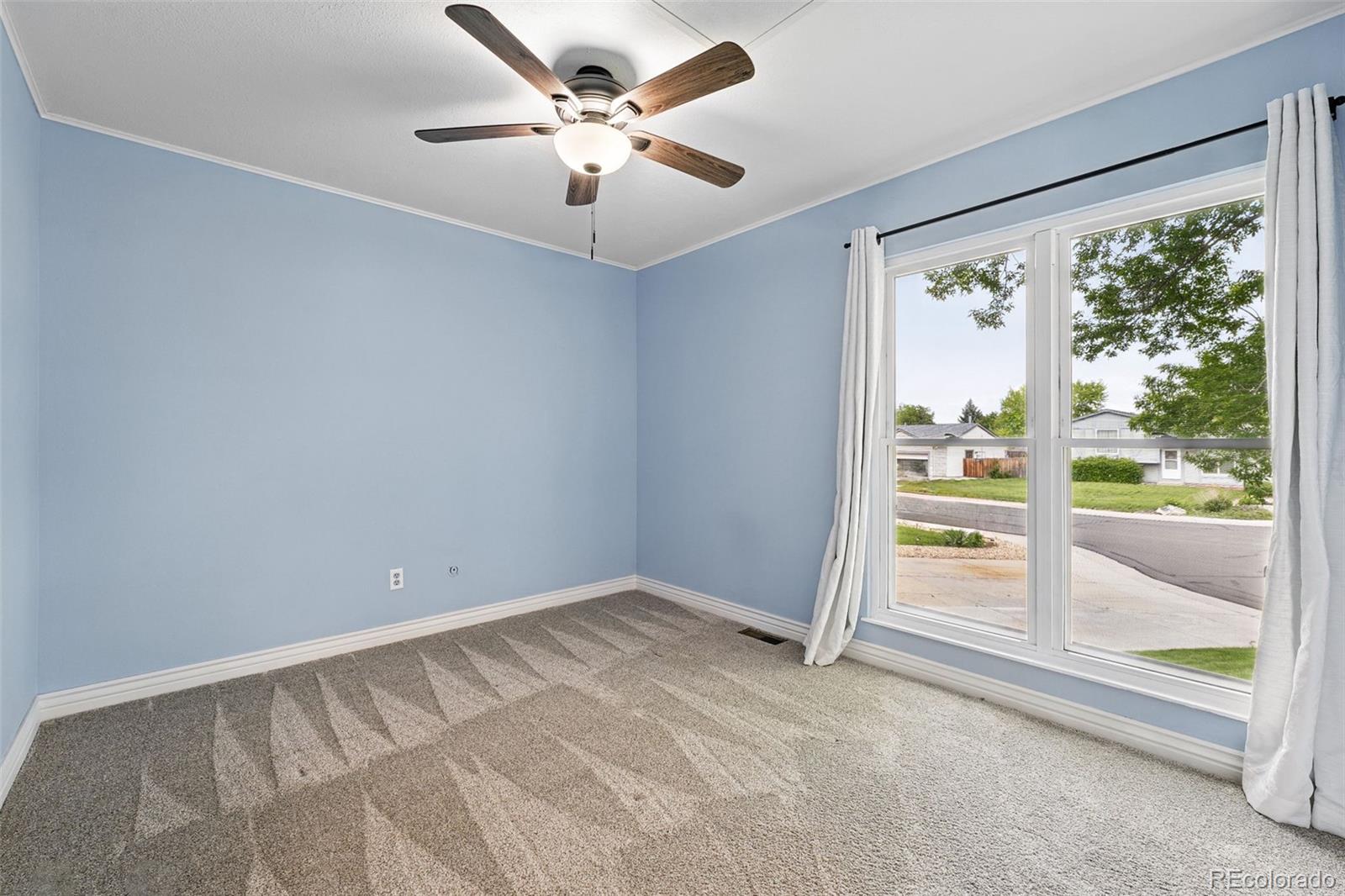 9315 Field Lane Westminster, CO 80021 - Photo 25 of 50 a view of an empty room with a window
