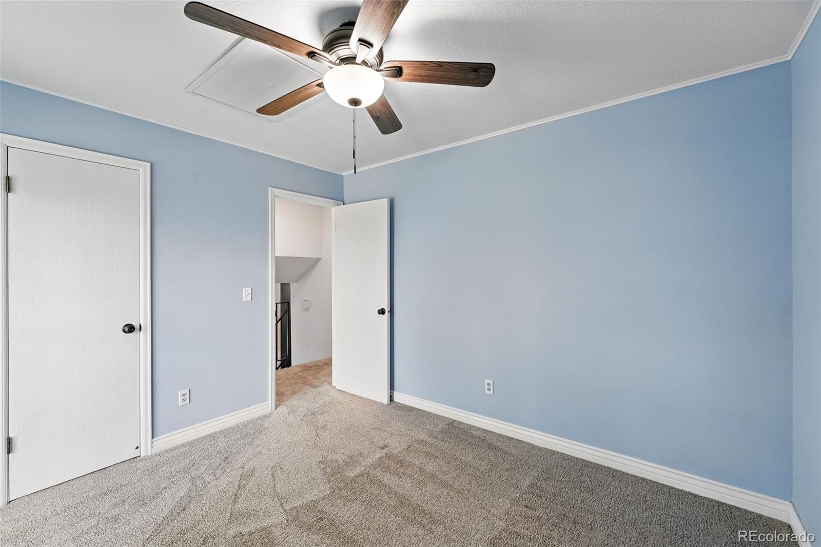 9315 Field Lane Westminster, CO 80021 - Photo 26 of 50 en empty room with fan and a ceiling fan