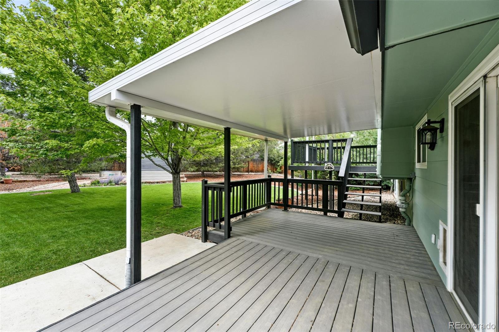 9315 Field Lane Westminster, CO 80021 - Photo 27 of 50 a view of a balcony with wooden floor and fence