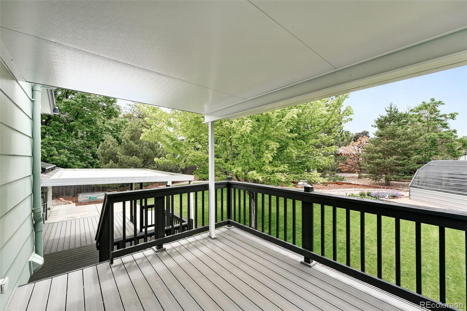 9315 Field Lane Westminster, CO 80021 - Photo 30 of 50 a view of balcony with wooden floor