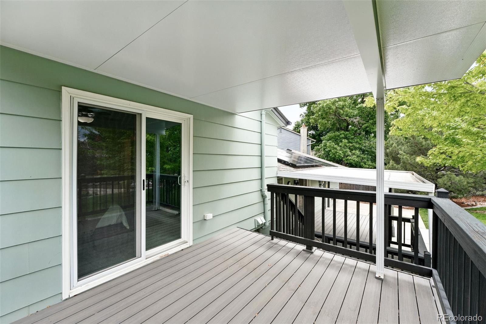 9315 Field Lane Westminster, CO 80021 - Photo 31 of 50 a view of a balcony with wooden floor