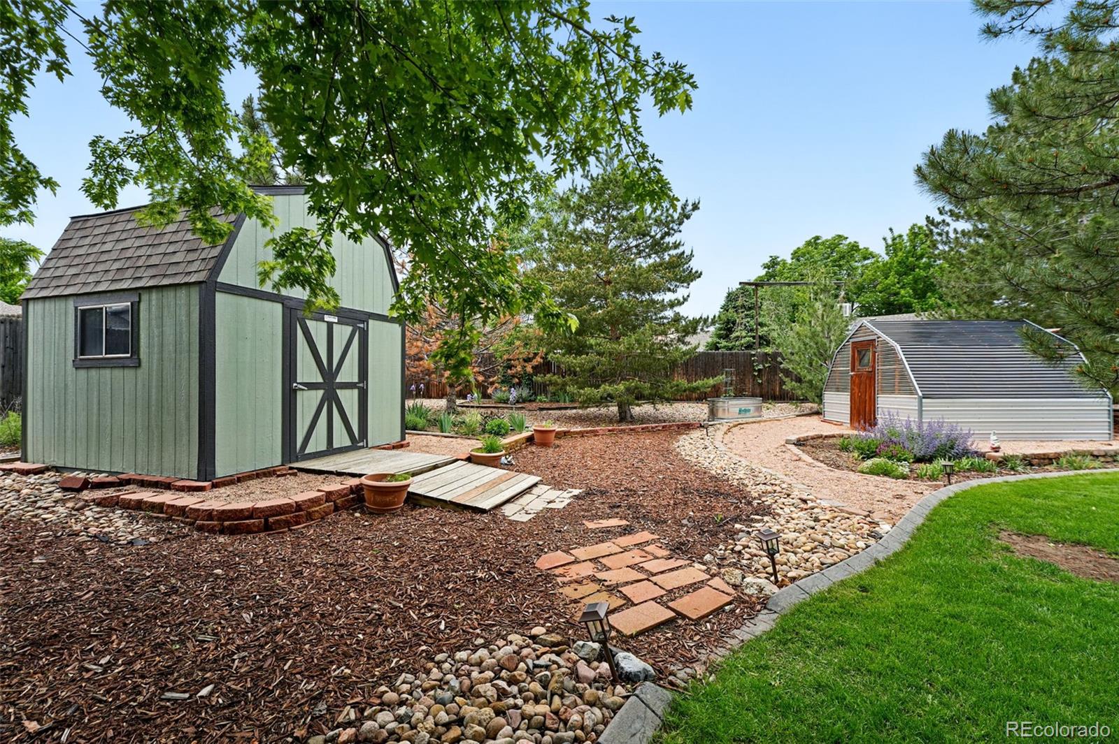 9315 Field Lane Westminster, CO 80021 - Photo 37 of 50 a view of a backyard with a garden