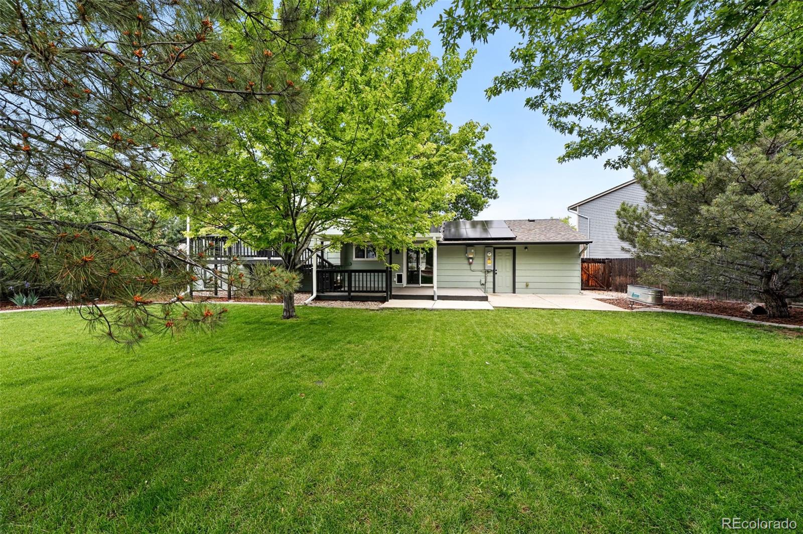 9315 Field Lane Westminster, CO 80021 - Photo 40 of 50 a view of a house with a backyard