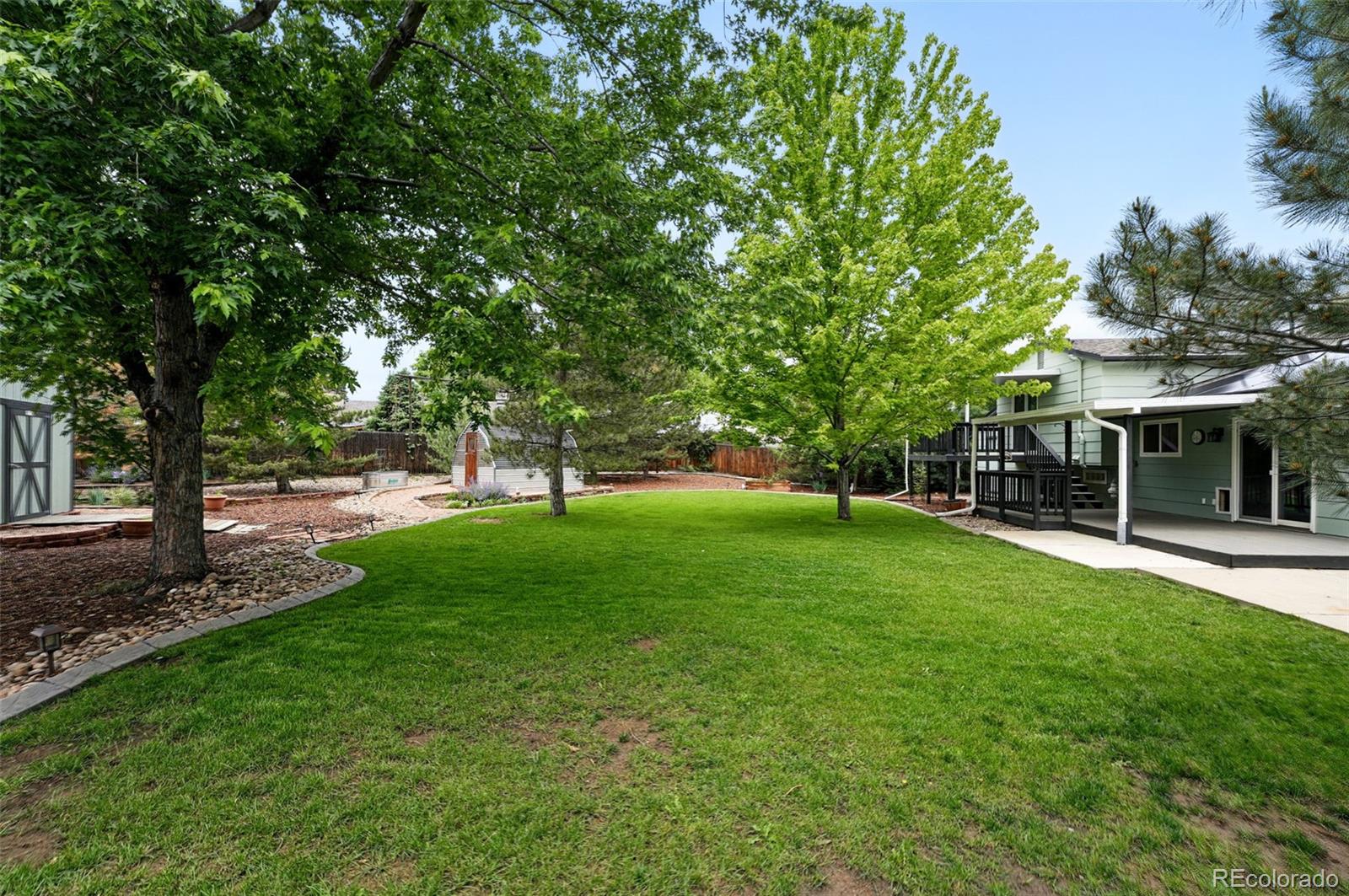 9315 Field Lane Westminster, CO 80021 - Photo 41 of 50 a view of a house with a yard