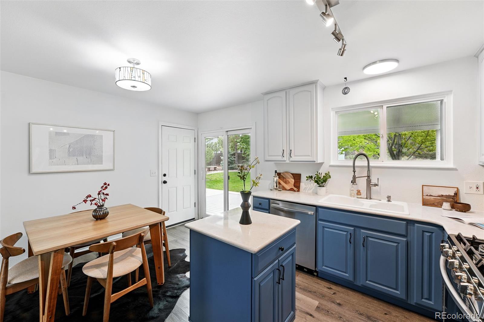9315 Field Lane Westminster, CO 80021 - Photo 9 of 50 a kitchen with a sink cabinets and window