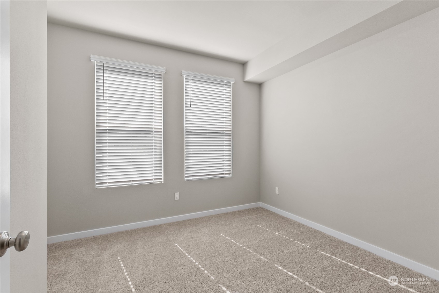 23413 Edmonds Way, Unit E1 Edmonds, WA 98026 - Photo 11 of 27 a view of an empty room with a window