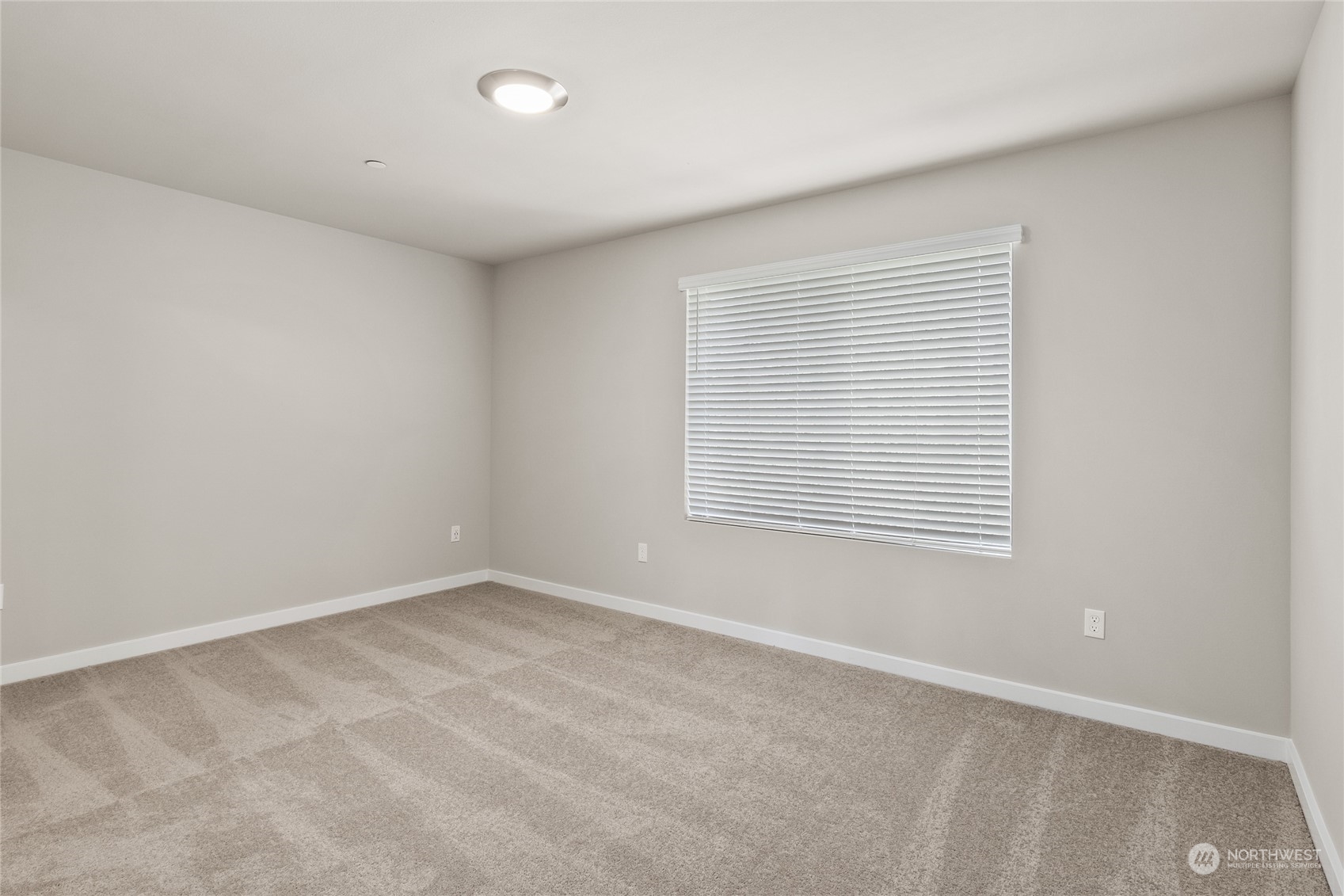 23413 Edmonds Way, Unit E1 Edmonds, WA 98026 - Photo 15 of 27 an empty room with a window