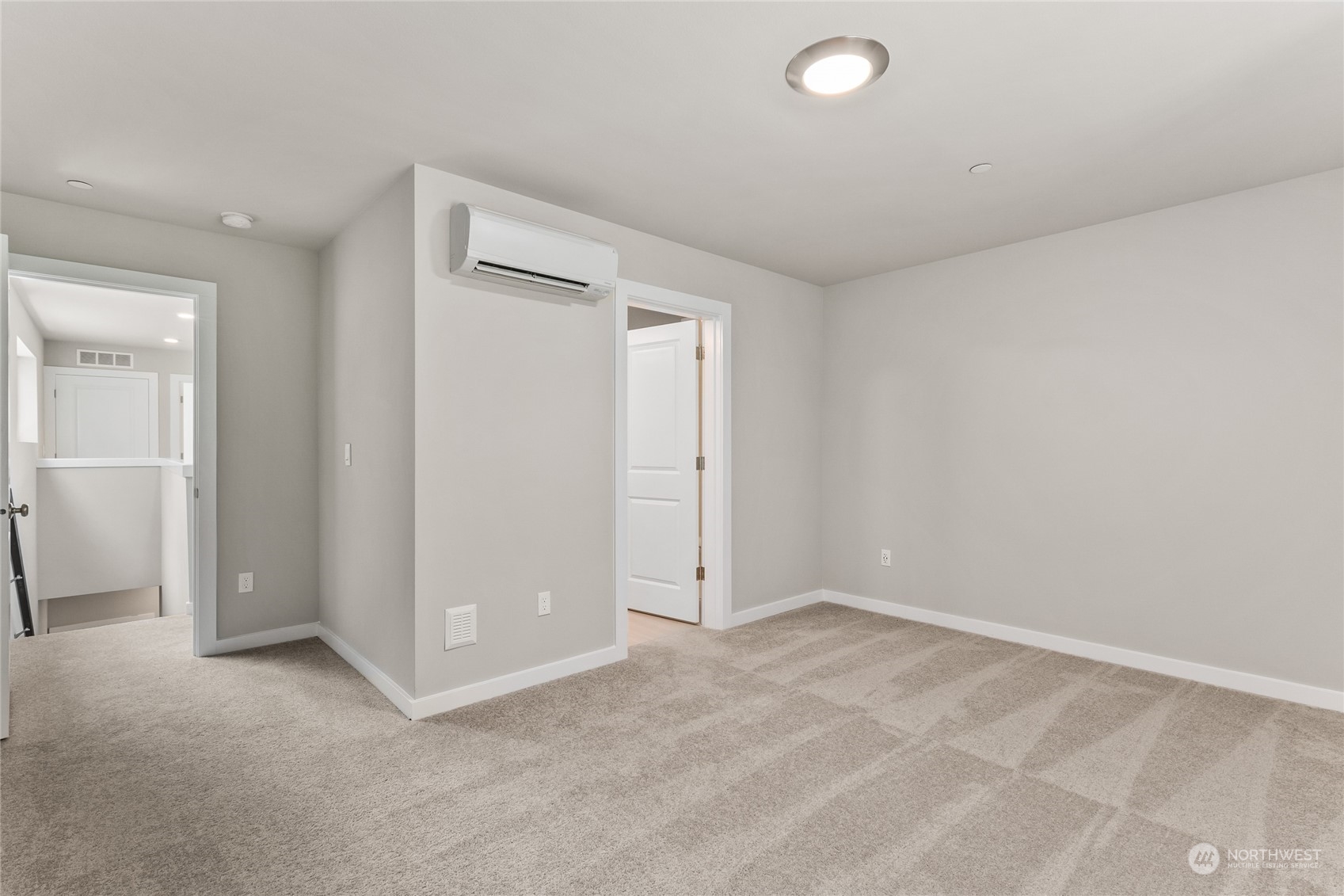 23413 Edmonds Way, Unit E1 Edmonds, WA 98026 - Photo 16 of 27 an empty room with closet and a window